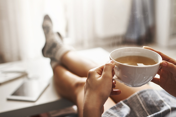 person drinking tea