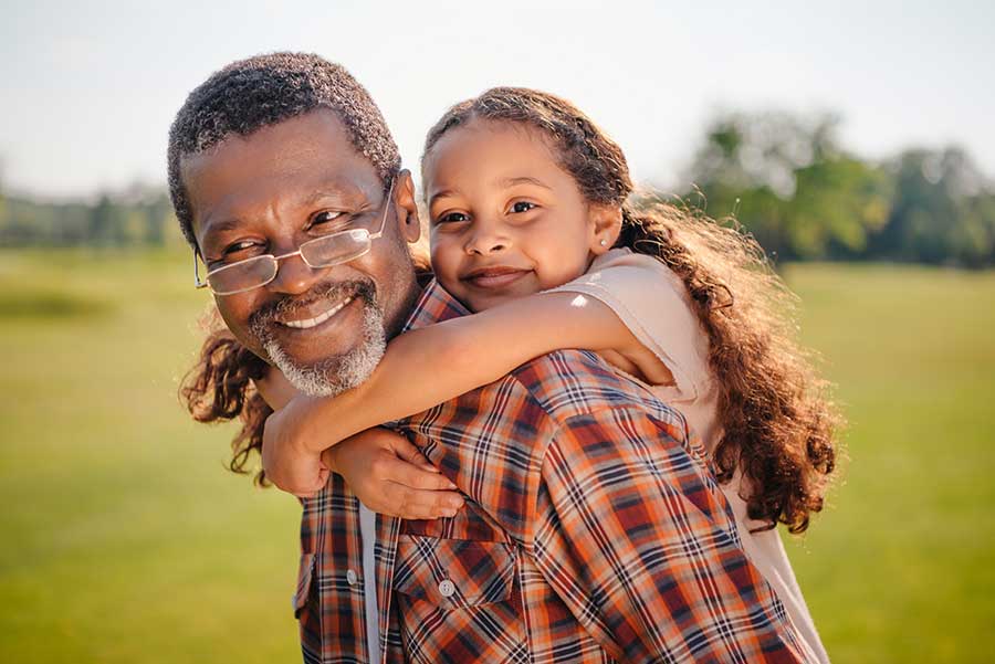 Happy black grandparent and granddaughter leaving a legacy with an annuity death benefit